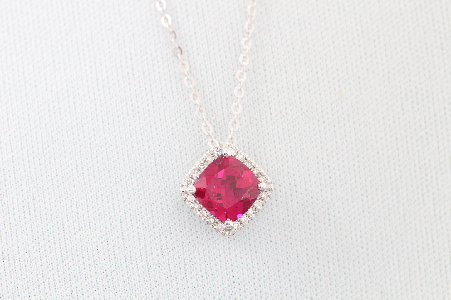 10k synthetic ruby and diamond pendant