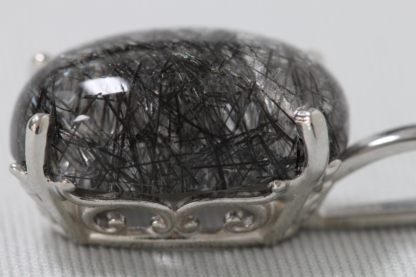 Silver tourmalinated quartz pendant