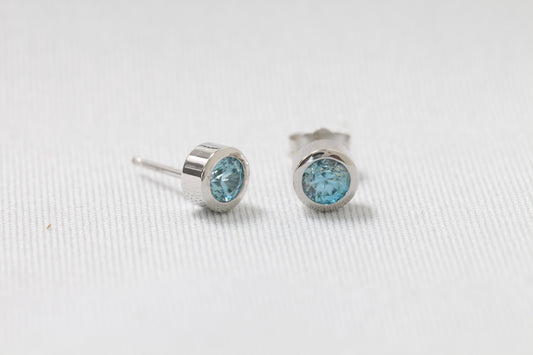 14k gold blue zircon bezel earring studs