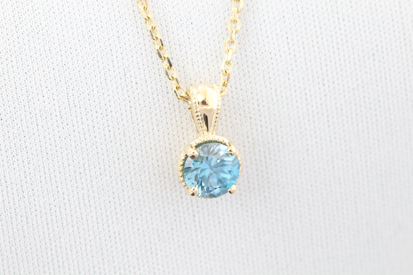 14k blue zircon pendant