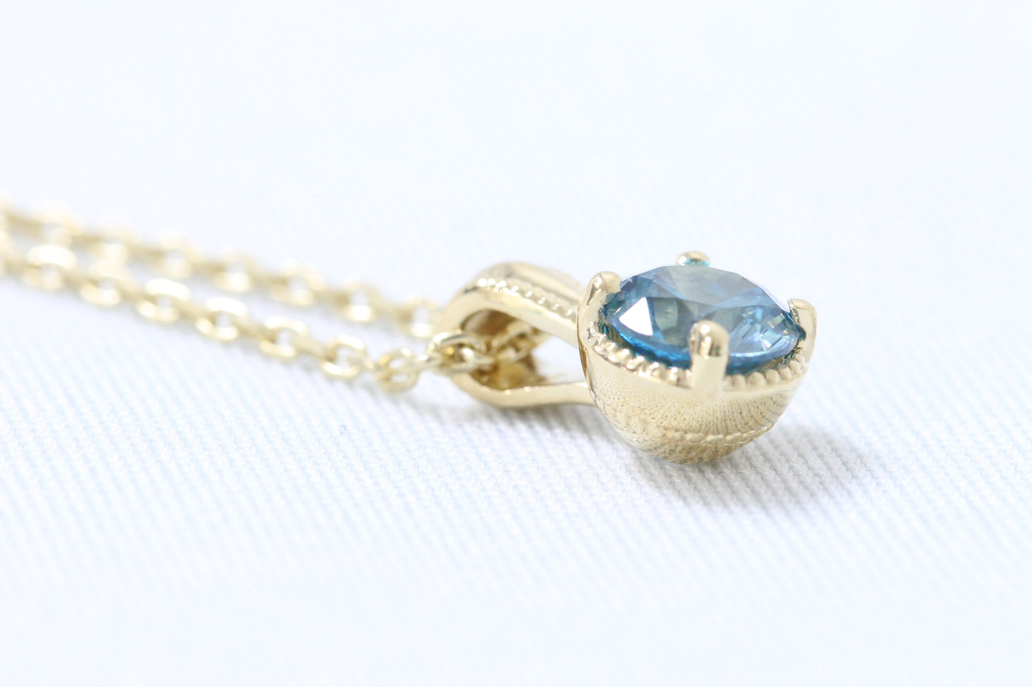 14k blue zircon pendant
