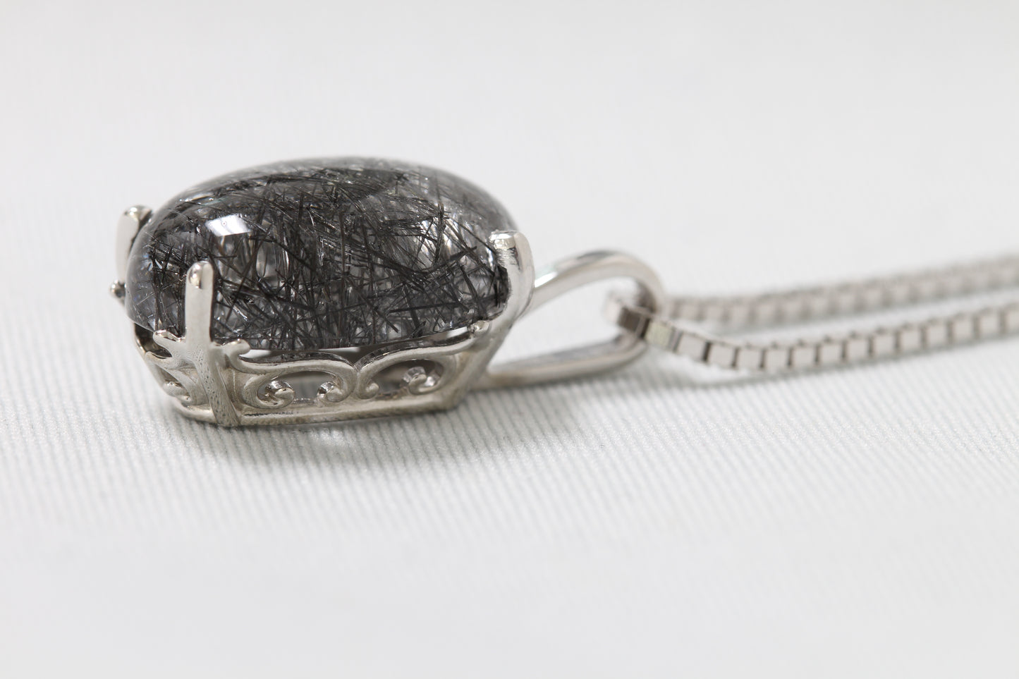 Silver tourmalinated quartz pendant